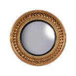 A REGENCY GILTWOOD CIRCULAR CONVEX WALL MIRROR, CIRCA 1820