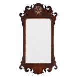 A GEORGE II WALNUT AND PARCEL GILT WALL MIRROR, CIRCA 1755