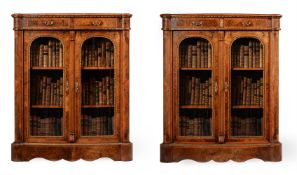 A PAIR OF VICTORIAN FIGURED WALNUT, WALNUT CROSSBANDED AND GILT METAL MOUNTED BOOKCASES