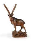 A SWISS 'BLACK FOREST' CARVED PINE MODEL OF A MALE IBEX, LATE 19TH/EARLY 20TH CENTURY