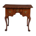 A GEORGE I WALNUT AND CROSSBANDED SIDE TABLE, CIRCA 1720