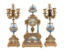 A FRENCH GILT METAL AND PORCELAIN MANTEL CLOCK GARNITURE