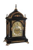 A LATE VICTORIAN BRASS MOUNTED EBONISED QUARTER-CHIMING BRACKET CLOCK