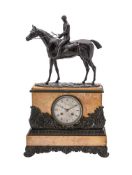 A FRENCH LOUIS PHILIPPE PATINATED BRONZE AND SIENA MARBLE FIGURAL EQUESTRIAN MANTEL CLOCK