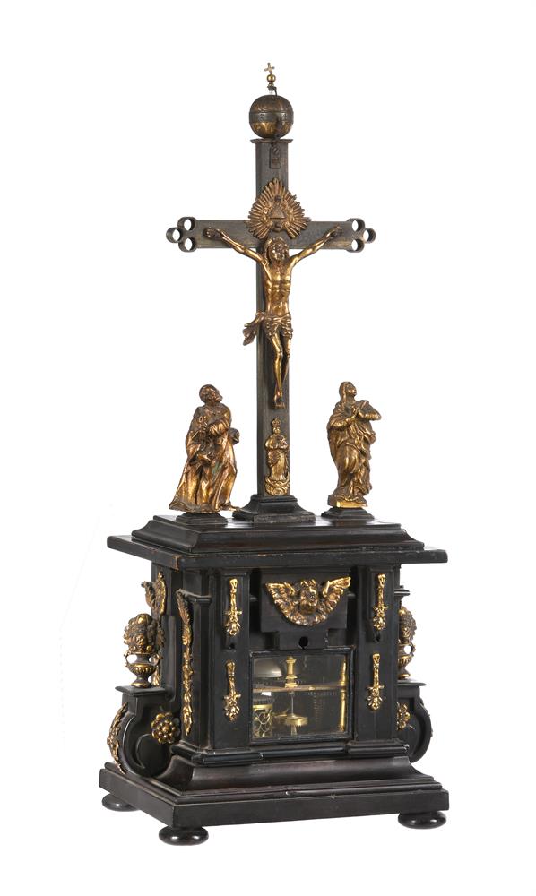 A FINE AND RARE GERMAN RENAISSANCE GILT BRASS MOUNTED EBONISED CRUCEFIX CLOCK WITH ALARM