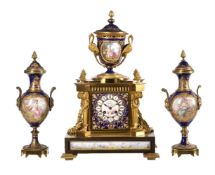 A FRENCH PORCELAIN INSET ORMOLU MANTEL CLOCK