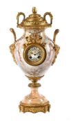 A FRENCH BELLE EPOCHE ORMOLU MOUNTED PORCELAIN URN-SHAPED MANTEL CLOCK