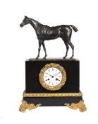 A FRENCH LOUIS PHILIPPE PATINATED BRONZE AND ORMOLU MOUNTED BELGE NOIR MARBLE MANTEL CLOCK