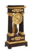 A FRENCH CHARLES X ORMOLU AND PATINATED BRONZE PORTICO MANTEL CLOCK