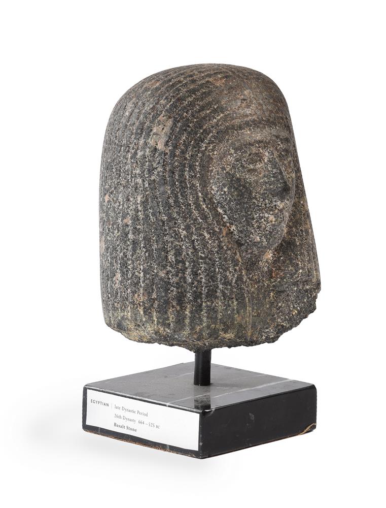 A BASALT HEAD OF AN EGYPTIAN FIGURE, POSSIBLY LATE DYNASTIC PERIOD - Image 2 of 3