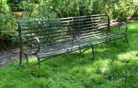 A LARGE FOUR-SEATER IRON STRAPWORK BENCH, MID 19TH CENTURY