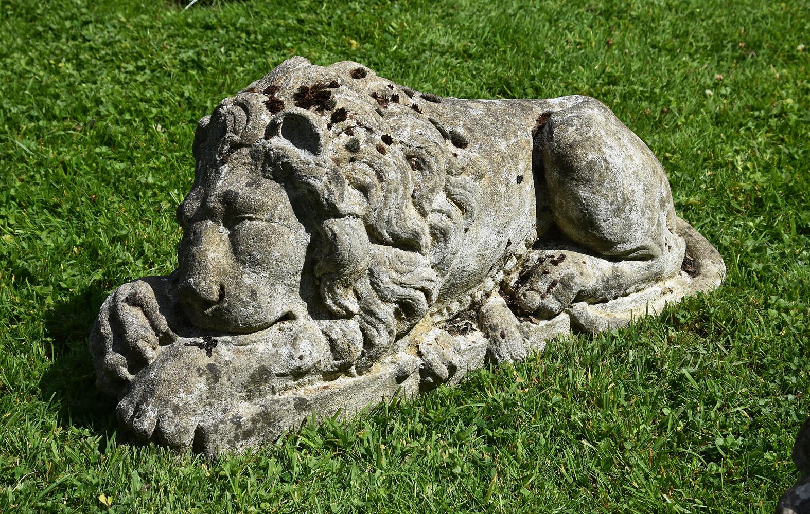 A PAIR OF COMPOSITION STONE MODELS OF RECUMBENT LIONS, 20TH CENTURY - Image 2 of 4