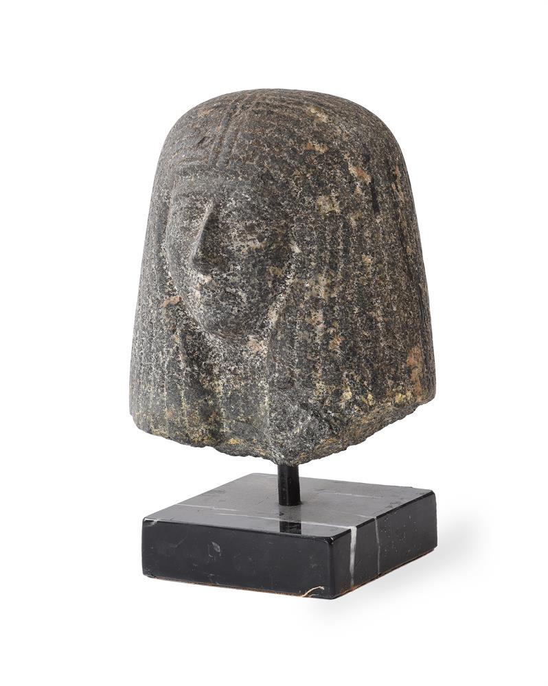 A BASALT HEAD OF AN EGYPTIAN FIGURE, POSSIBLY LATE DYNASTIC PERIOD