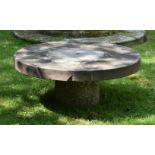 A CIRCULAR LOW TABLE WITH STONE TOP AND GRANITE BASE, 19TH CENTURY AND LATER