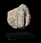 A CARVED LIMESTONE FRAGMENT, POSSIBLY FRENCH 14TH CENTURY