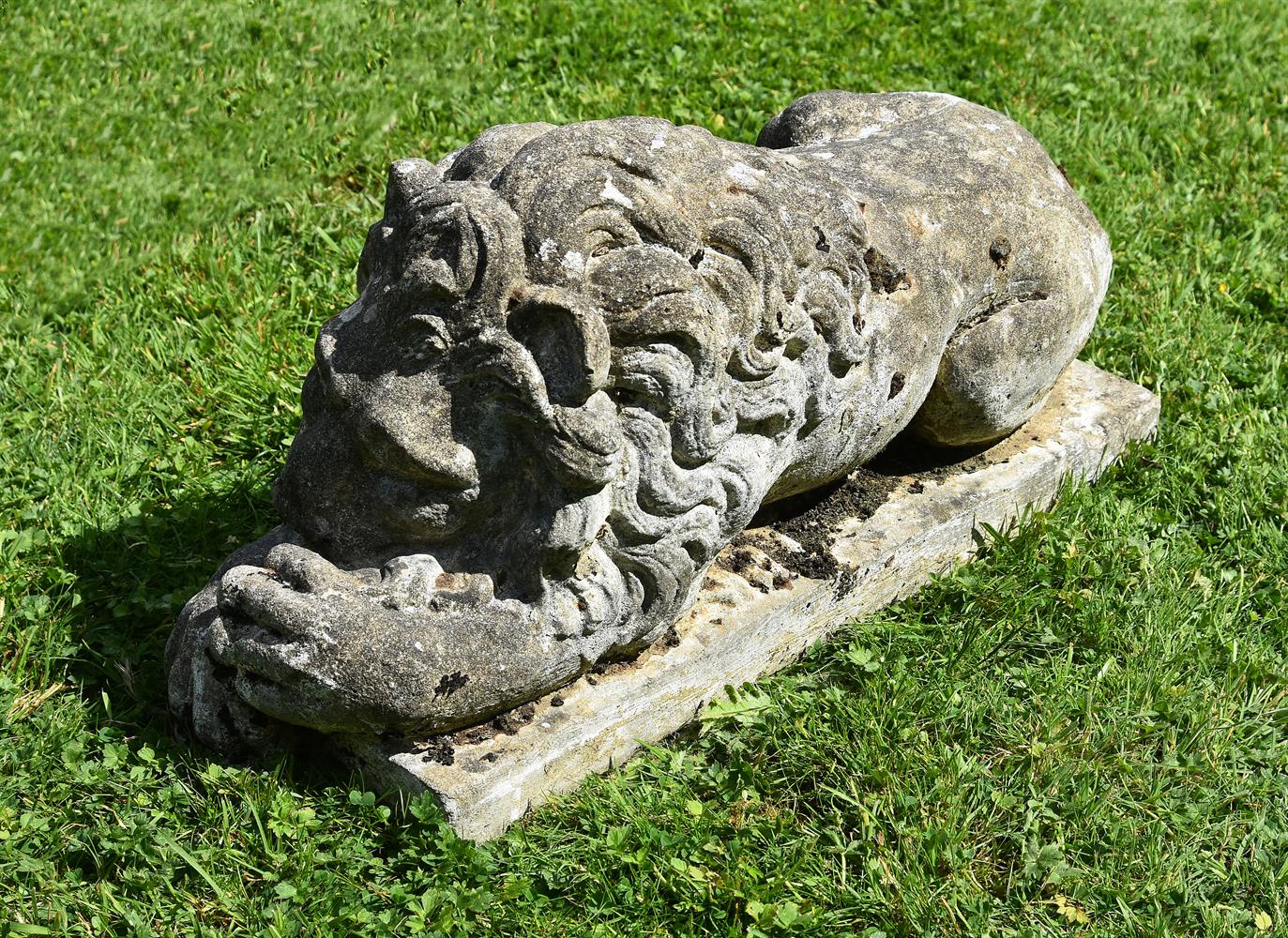 A PAIR OF COMPOSITION STONE MODELS OF RECUMBENT LIONS, 20TH CENTURY - Image 3 of 4