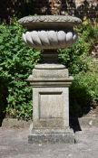 A COMPOSITION STONE PEDESTAL URN CENTREPIECE, 20TH CENTURY