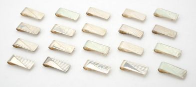 A collection of silver rectangular money clips