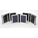 Three silver mounted folding double photo frames by Kitney & Co.