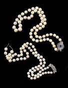 A cultured pearl necklace with a mid 20th century sapphire and diamond clasp