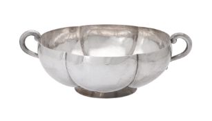 A Mexican silver coloured twin handled shaped circular bowl