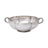 A Mexican silver coloured twin handled shaped circular bowl