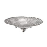 An Egyptian silver coloured shaped circular bowl