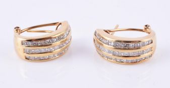 A pair of diamond hooped earrings