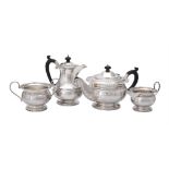 A silver circular four piece tea service by G. Bryan & Co.