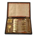 A cased French silver gilt set of twelve tea spoons