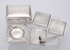 A collection of silver smoking accessories