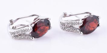 A pair of garnet and diamond ear clips