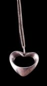 A silver heart shaped pendant by Henning Koppel for Georg Jensen