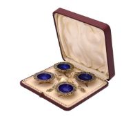 A set of four late 19th century silver gilt and plique-à-jour enamel shaped circular salt cellars