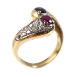 A ruby, sapphire and diamond crossover ring