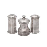 A pair of Edwardian silver cylindrical pepperettes by Haseler Brothers