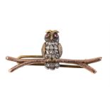 An early 20th century rose cut diamond and ruby owl brooch