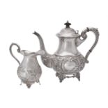 An Indian silver coloured baluster tea pot and cream jug