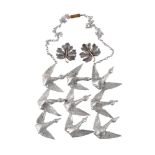 The Flight by Jef Claerhout, a silver coloured abstract bird necklace