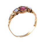 A Victorian garnet and opal three stone ring