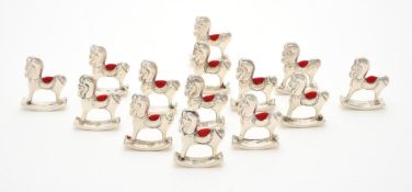 Fourteen silver mounted rocking horse pin cushions