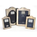 Four silver mounted shaped rectangular photo frames