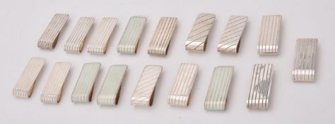 A collection of silver rectangular money clips