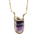 Y An 18 carat gold fluorite, pyrite, diamond, emerald, sapphire and mother of pearl pendant