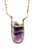 Y An 18 carat gold fluorite, pyrite, diamond, emerald, sapphire and mother of pearl pendant