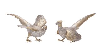 A pair of German silver parcel gilt models of pheasants