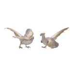 A pair of German silver parcel gilt models of pheasants