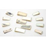 A collection of silver plain rectangular money clips