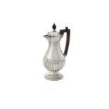 A late Victorian silver lobed baluster water jug by Goldsmiths & Silversmiths Co.