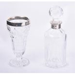 A silver mounted cut glass decanter by K. M. Silver